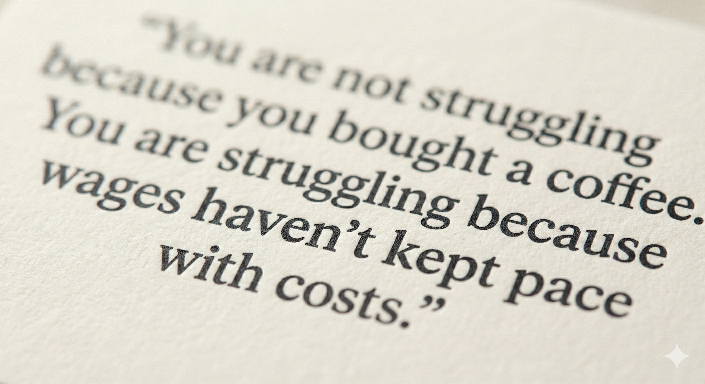 Close-up of a reminder card showing the text 'wages haven't kept pace' on thick textured cream paper