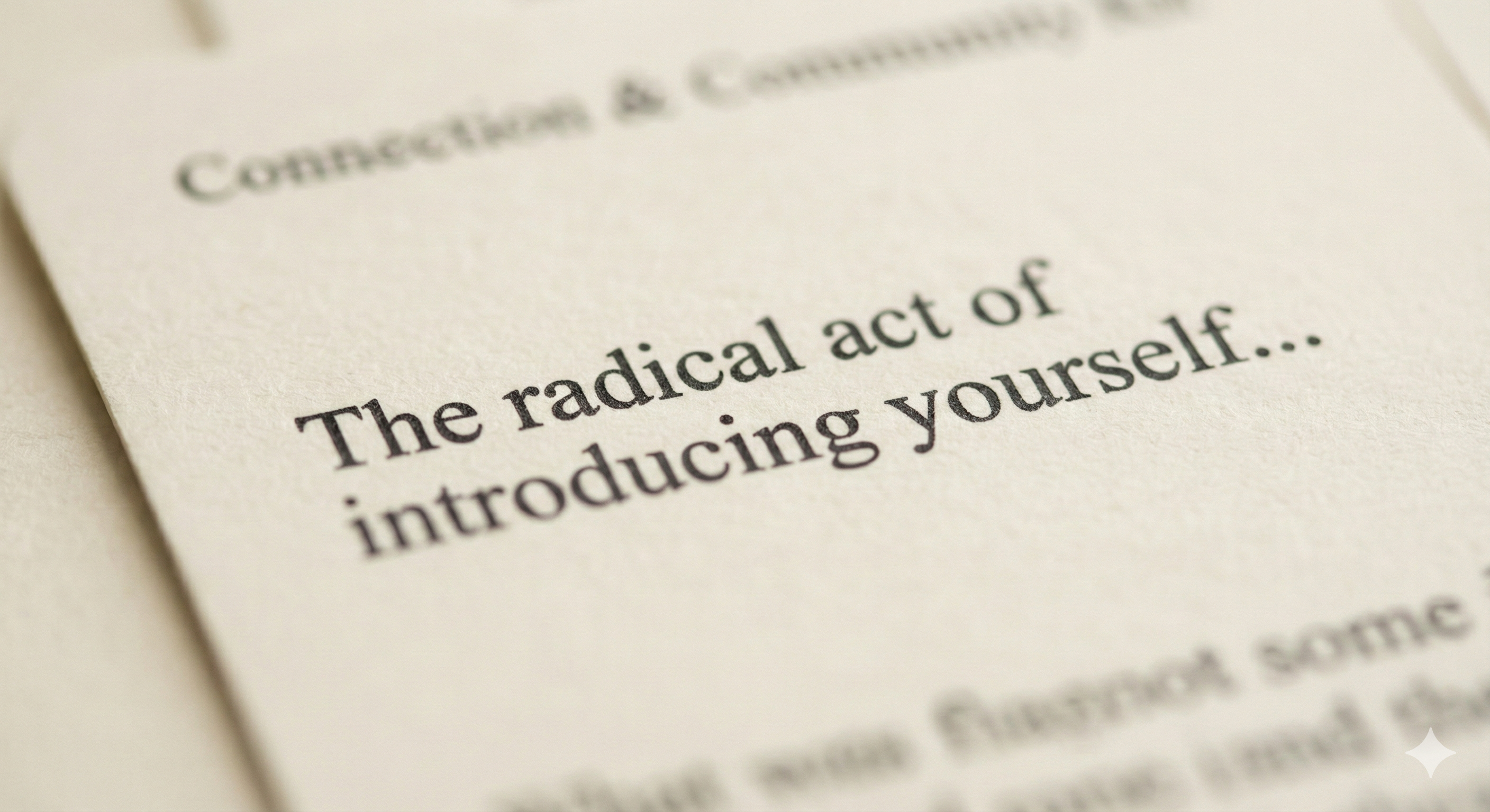 Close-up of a Neighbour Conversation Starters card showing the text 'The radical act of introducing yourself' on cream paper
